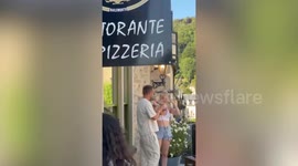 Singer James Morrison stages surprise gig from restaurant balcony with his daughter