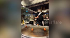 Woman tries to throw egg like a chef but fails
