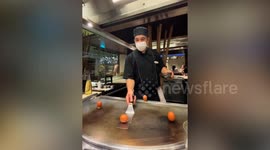Woman tries to throw egg like a chef but fails