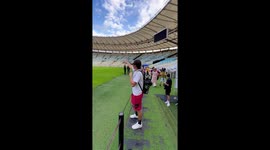 Man startles after bumping head on low player bench roof in Rio de Janeiro, Brazil