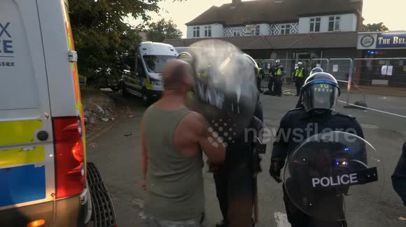 “You knocked my fu**ing teeth out!” - Moment riot police smash shield into gent’s face in Epping clash