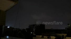 Lightning strikes and lingers on tower during storm in Guangdong, China
