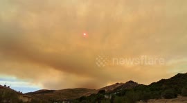 Spain: Smoke Turns Sun Into Glowing Ember Over Forest Fire In Spain