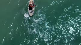 A man and his kayak on the sand at the beach of Kino Bay in the municipality of Hermosillo, part of the Gulf of California, also known as the Sea of Cortez or Bermejo Sea, in the central-western region of the state of Sonora, in the Sonoran Desert, and on