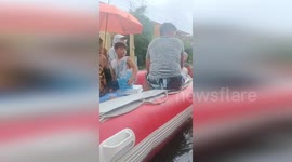 Philippines: Rescue Boats Carry Families And Pets Through Flooded Streets In Pampanga