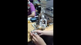 DIY fanatic makes working model excavator from syringes and cardboard