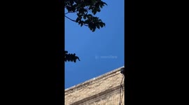 Video of possible UFO sighting. Round shiny object over Inwood New York at fast speed and sharp turn during daytime.