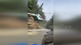 Spain: Pilot Lands Helicopter So Low It Nearly Touches Water To Rescue Three