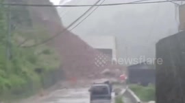 Rockslide leaves motorists stranded on blocked road during Typhoon Co-may
