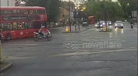 Moped fleeing police almost collides with pedestrian