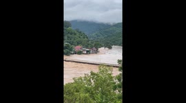 Landslides cause trees and houses to fall into the river in Vietnam