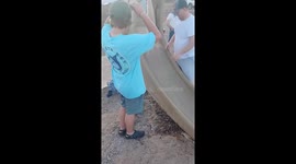 Homemade hillside slip-and-slide ends in splash with friends in Camp Verde, Arizona
