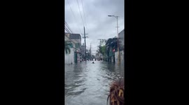 Flood-hit residents chant prayers in knee-deep water