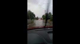 Cars battle through deadly floods in Romania