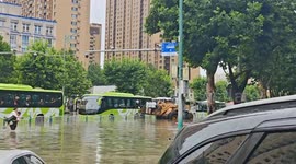 Flood rescue using loader scoop in Hebei, China