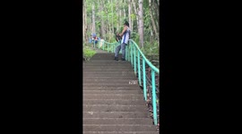 Kids whizz down metal handrail over 2,000 steps in the Philippines