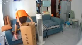 Hilarious moment young boy accidentally slides himself into narrow box