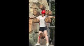 Girl who volunteered to face axe thrower flinches as weapons strike