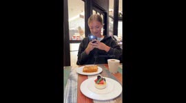 Girl tries for the perfect dessert picture but boy’s mischief spoiled it