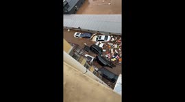 Intense flooding sweeps vehicles away in Beijing, China