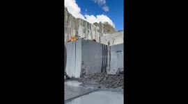 Look at this amazing view of a gigantic slab of granite being pulled over!