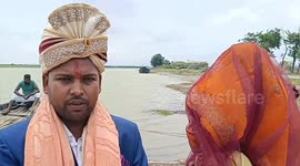 Come hell or high water! Determined groom travels by boat through floodwater to wedding