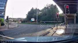 Does the black fiesta jump the red light?