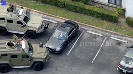 US: Armored Trucks Surround Vehicle As SWAT Arrests Gunman At Tampa Apartment Complex