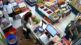 Bizarre moment liquid sprays out of watermelon as shopkeeper goes to cut it open