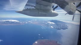 Hawaii coast guard checks the sea before tsunami alert is removed