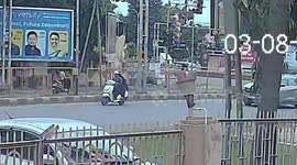 Schoolboy on bicycle falls under truck wheels before being saved by locals