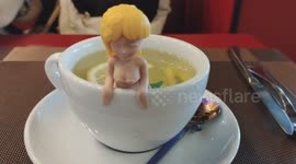 Mermaid Figurine Spotted Relaxing in Cup of Lemon Tea