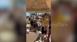 Elton John leaving Cannes celeb hotspot hand in hand with husband