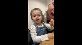 Mom shares daughter's comical reaction after dad devours entire lollipop