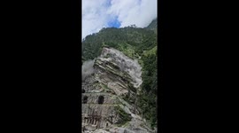 Onlookers scatter as landslide crashes down mountainside in India