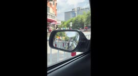 Three riders wearing funny masks spotted on scooter behind in Hunan, China