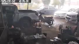 Roof collapses as storm hits motorcycle repair shop in Thailand