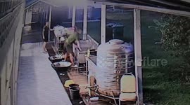 Don't troop! Soldier carrying giant wok slips on wet floor