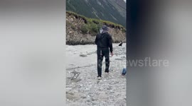 Five dead and dozens injured when suspension bridge cable snaps in China