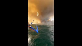 Athlete kitesurfs away as wildfire triggers evacuations in southern Spain