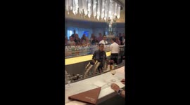 Girl bartender entertains tourists with flair moves on cruise ship