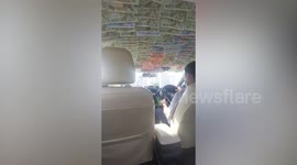 Taxi decorated with dozens of banknotes in Thailand