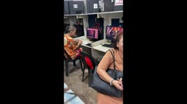 Elderly woman types quickly without looking at keyboard in Ermita, Manila