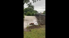 Floodwaters fill Swan Slicer railroad bridge in Wauwatosa, Wisconsin, USA