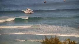 Ferry runs aground on reef amid strong waves in Hawaii