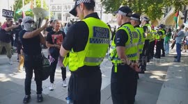 Protesters shouting 'You're supporting genocide' at the police force, during the rally in support of banned group Palestine Action