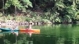 20160828 Children canoeing and fishing on a lake