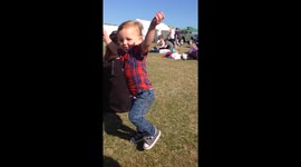 Cheeky toddler 'flirts' with woman at car show