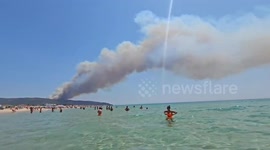Unreal Scenes: Beach Life Continues as Wildfire Smoke Darkens Tarifa