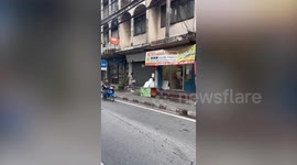 Youngster pedals on bicycle that looks like motorcycle